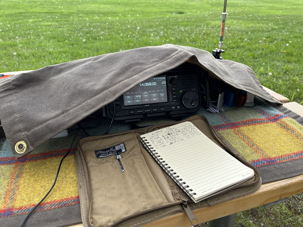 IC-705 and key covered by a folded over canvas tarp.