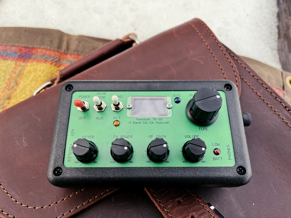 The TR-35 resting on a leather bag in all of its switchy-knobby glory.